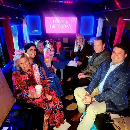 Happy Birthday limo group celebrating in a luxury party bus in Myrtle Beach.