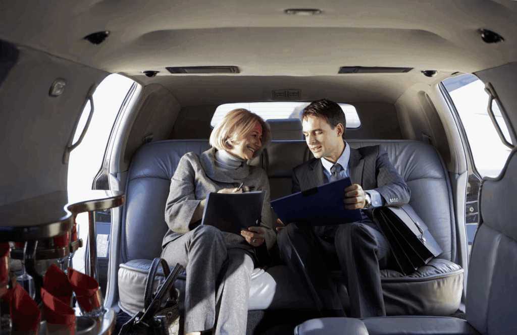Business professionals review documents in a luxury limo service in Myrtle Beach.