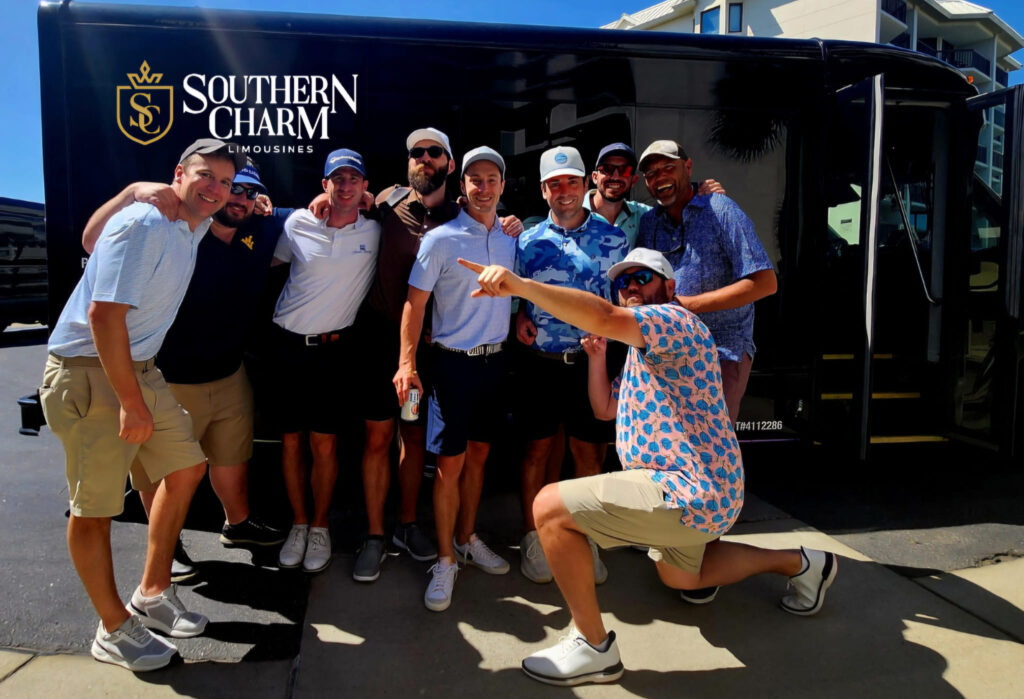 Southern Charm Limousines bus with happy golfers posing for a photo