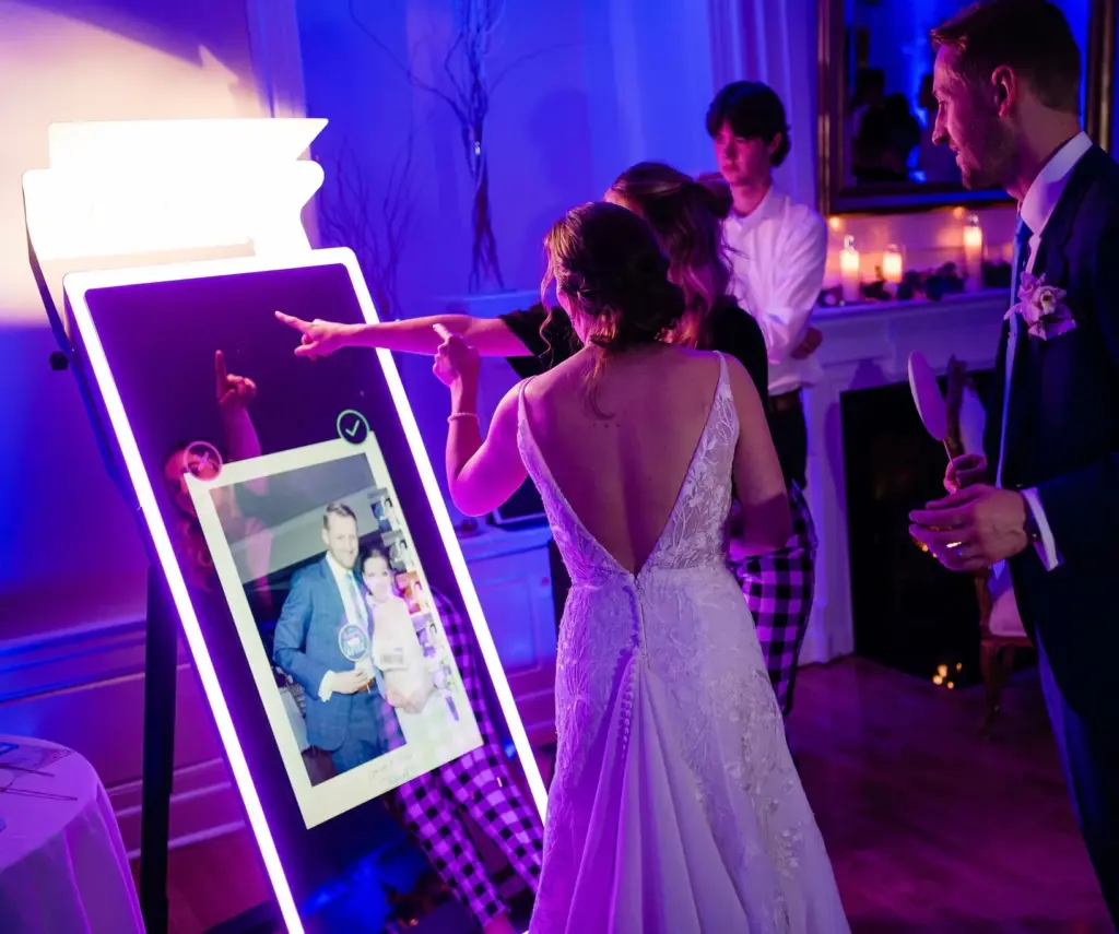 Mirror photo booth rental Myrtle Beach with bride and groom taking picture