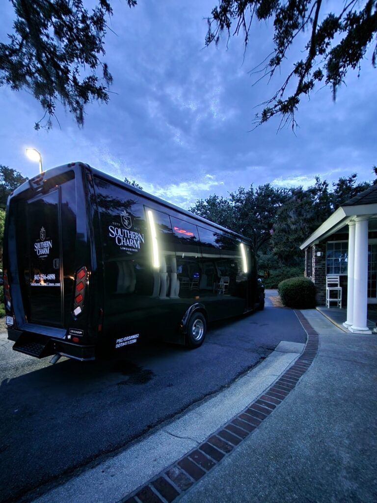 Black Southern Charm shuttle bus parked near a building in DeBordieu SC.